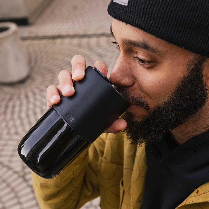 16oz-rise-tumbler-e8 16oz_rise_tumbler_black_man_drink_square.jpg