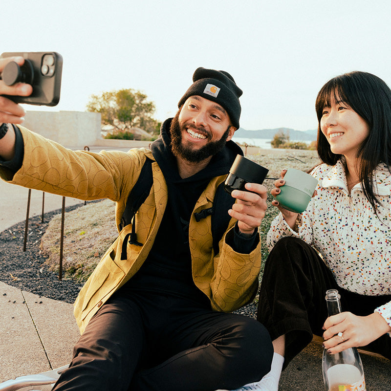 bring-your-own-party-kit-tumblers-and-cocktails-p0 8oz_rise_lowball_black_iceberg_couple_selfie_city_square.jpg
