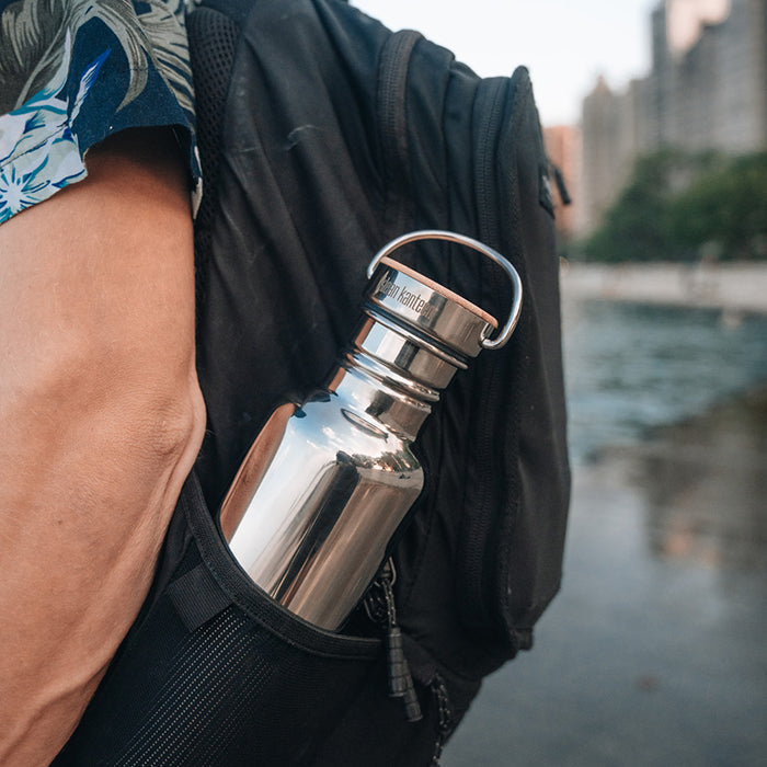 27oz-reflect-with-bamboo-cap-v8 K27SSLRF-MS-BAMBOO_reflect-bottle_backpack_lifestyle.jpg